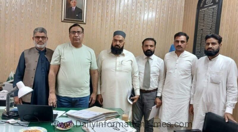 Chairman Naveed Akhtar and ETO Saqib Bhatti during a meeting regarding professional tax reduction in Sheikhupura.