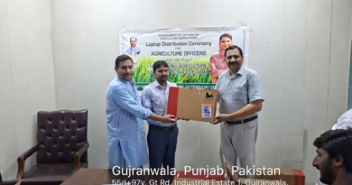 Director Agriculture Extension Dr. Shakeel Ahmed distributing laptops among the officers of the Agriculture Department.