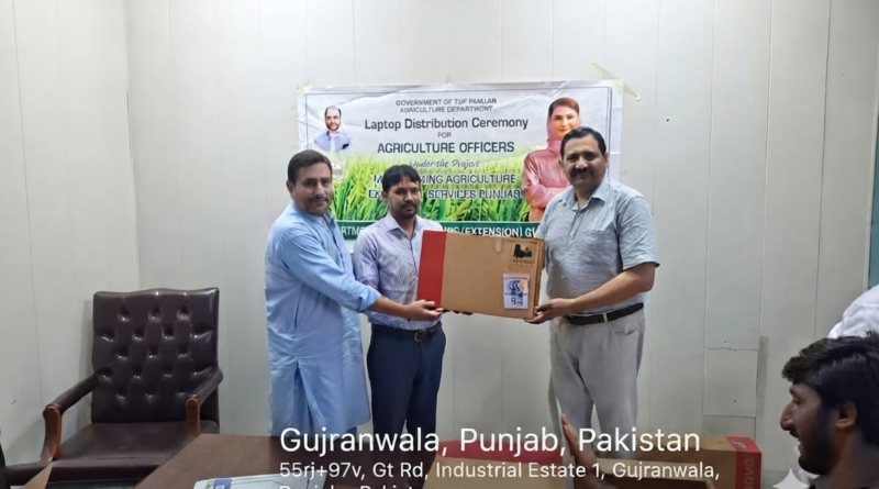 Director Agriculture Extension Dr. Shakeel Ahmed distributing laptops among the officers of the Agriculture Department.