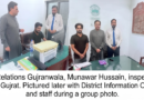 Director Public Relations Munawar Hussain reviewing records at the District Office Gujrat