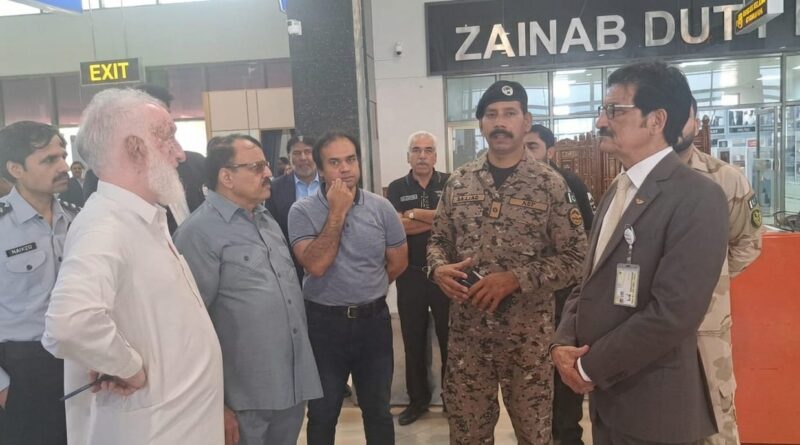 Federal Ombudsman Gujranwala In-charge Mushtaq Ahmad Awan conversing with passengers and officials at Sialkot Airport.